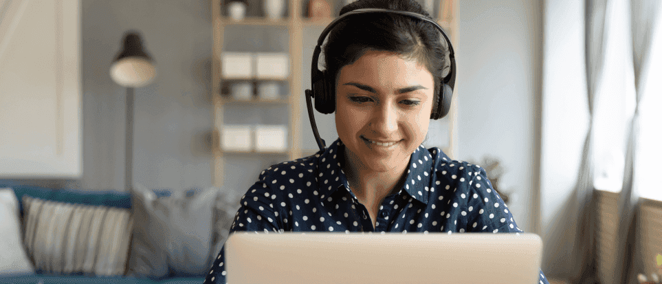 Woman wearing a headset and working at her computer