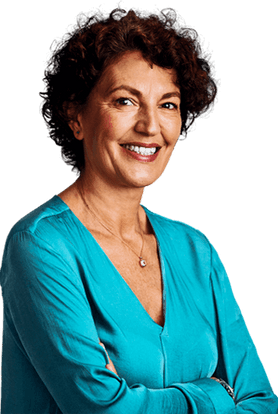 Woman with short hair smiling and wearing a turquoise blouse