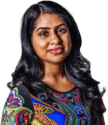 Smiling woman with long dark hair wearing a colorful shirt