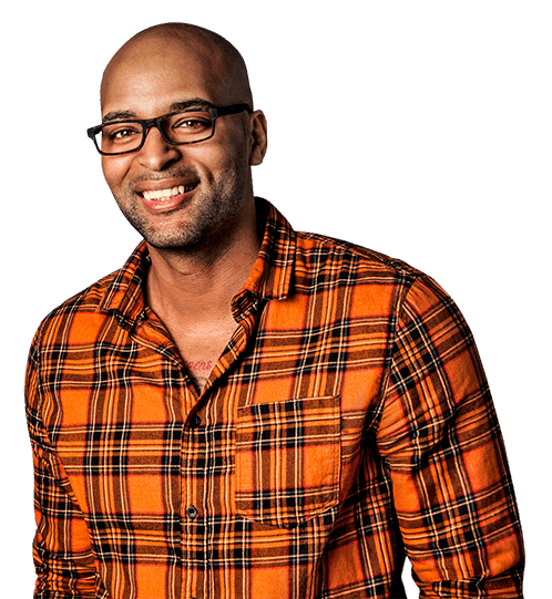Smiling black man wearing glasses and orange checkered shirt